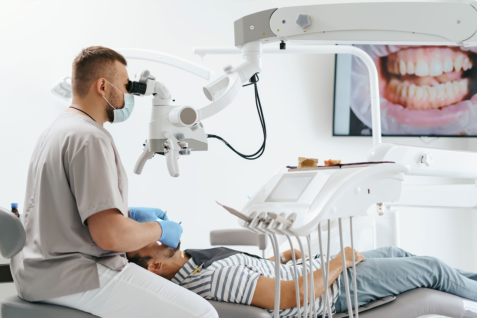 Dentist speaking with a patient during a consultation